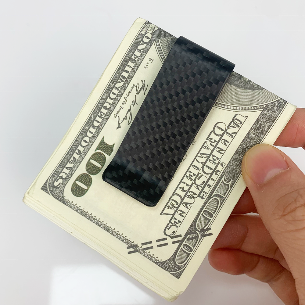 Close detail of the Drivingrich carbon fiber money clip with clean no logo design